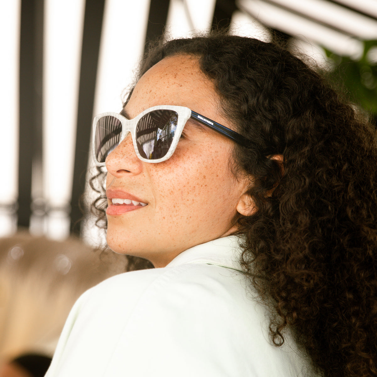 woman with white sunglasses