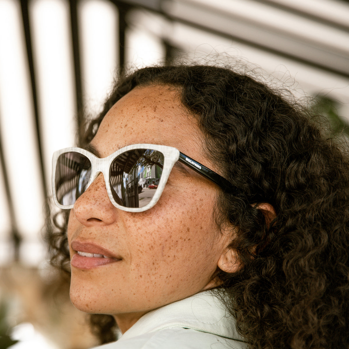 woman with white sunglasses