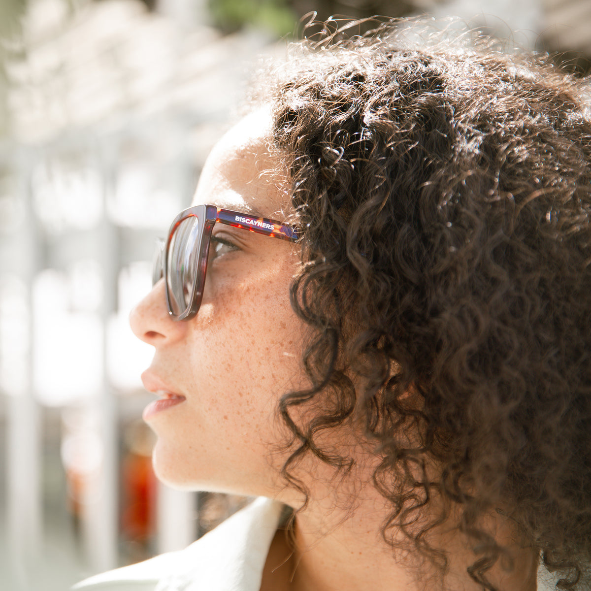 woman with tortoise sunglasses