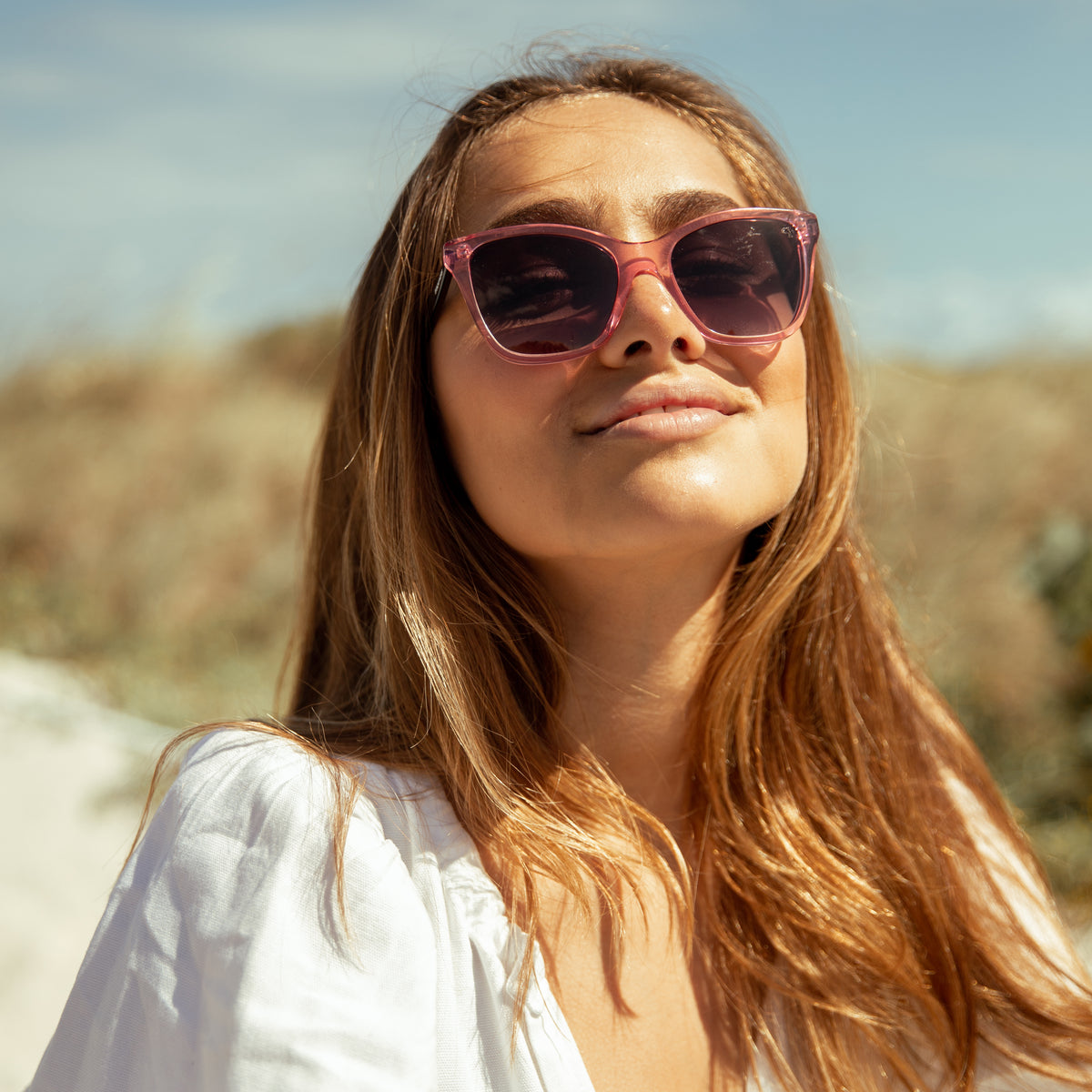 woman with pink sunglasses